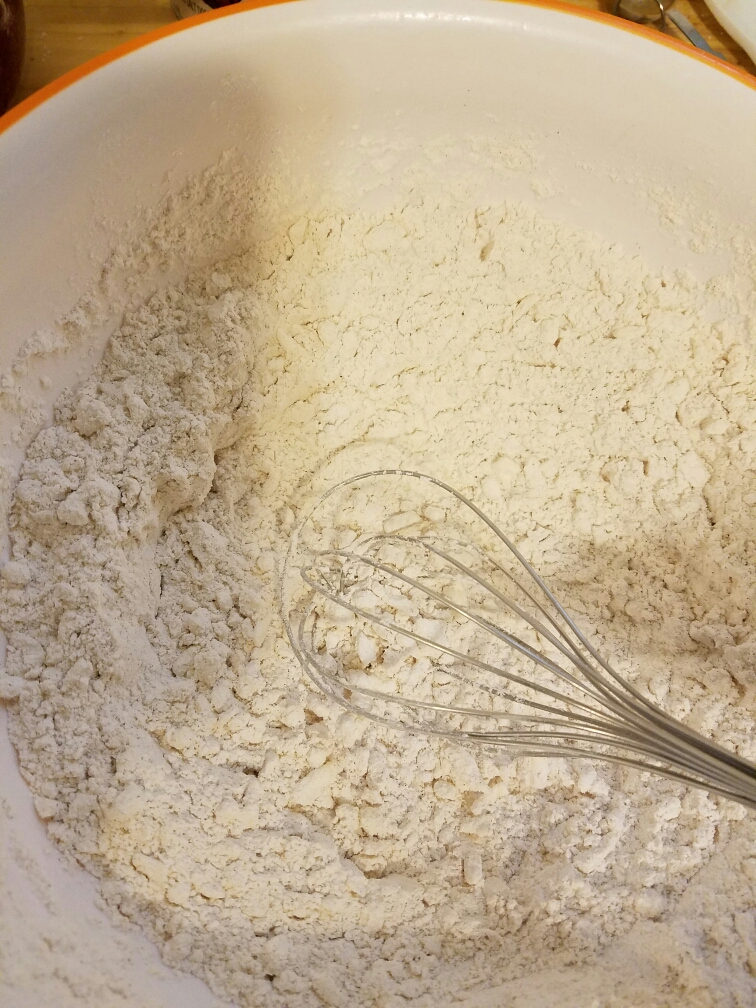 whisk in bowl of flour